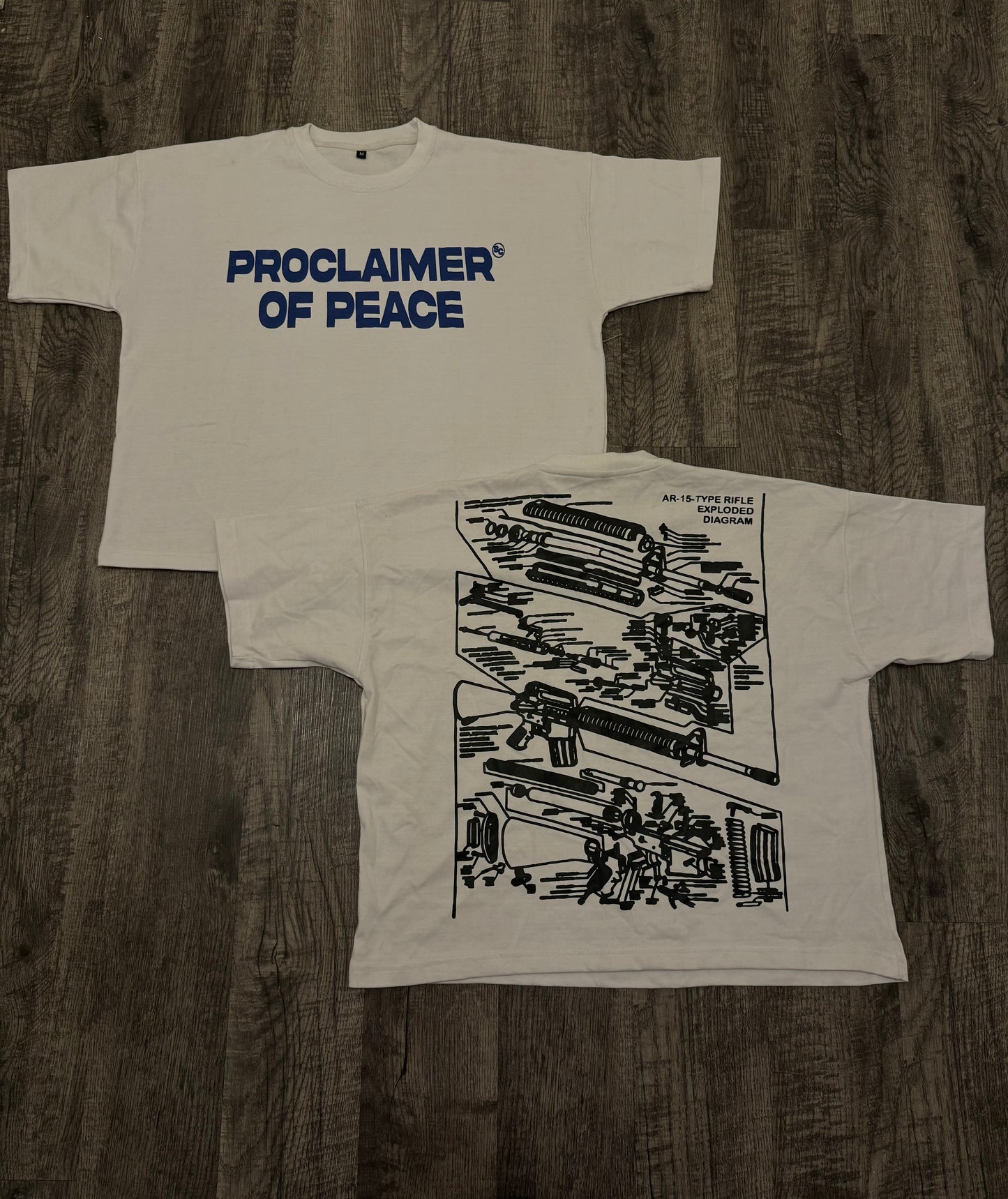 “PROCLAIMER OF PEACE TEES”